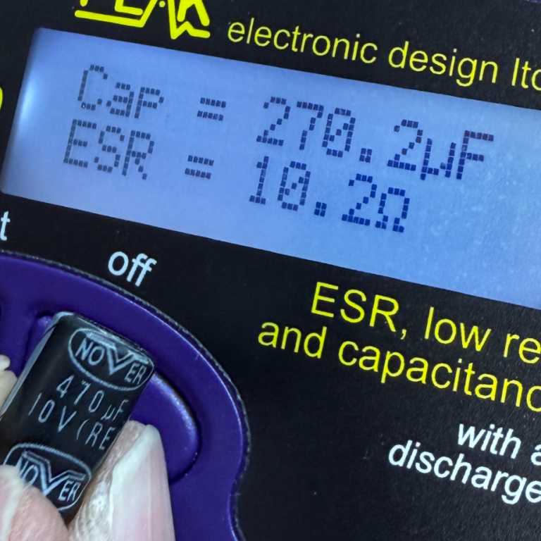 Bad capacitor with high ESR Meter displaying capacitance of 270.2µF and ESR of 10.2Ω for an electronic component.