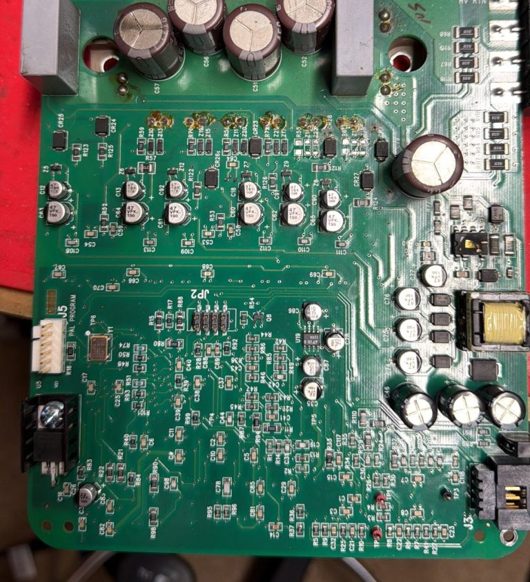 Mitsubishi PLC being repaired Mitsubishi PLC dismantled for repair