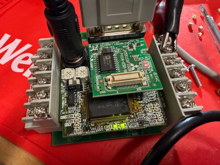 Mitsubishi PLC being repaired Mitsubishi PLC dismantled for repair